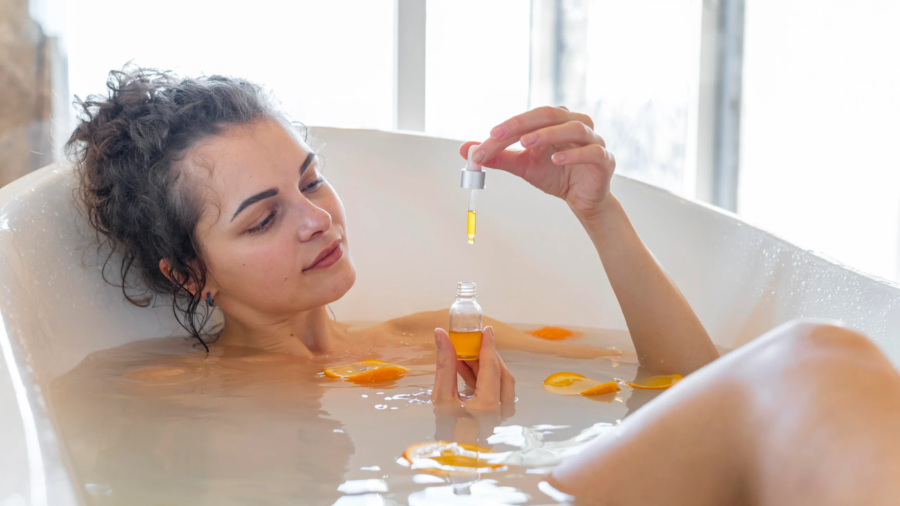 woman-relaxing-bathtub-with-orange-slices